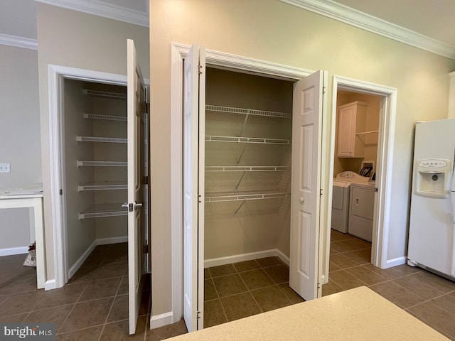 closet with washer and clothes dryer