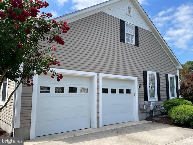 view of property exterior with a garage