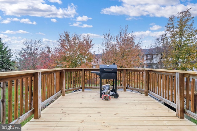 wooden terrace featuring grilling area