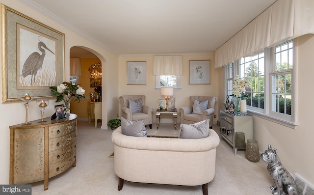 carpeted living room with ornamental molding