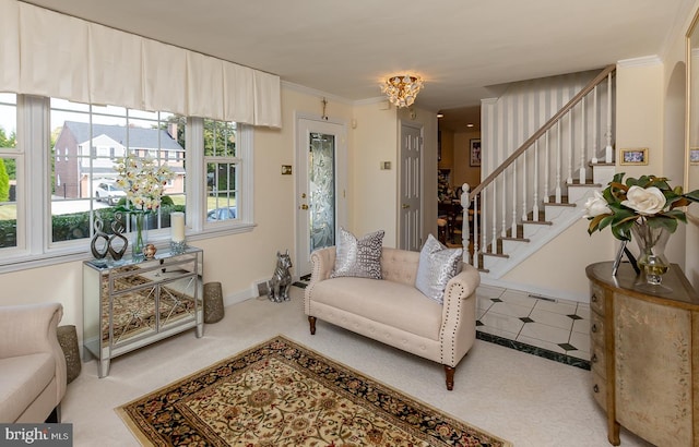 living room featuring carpet, a notable chandelier, and crown molding