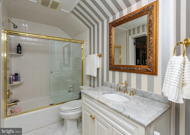 full bathroom featuring enclosed tub / shower combo, tile patterned flooring, vanity, and toilet