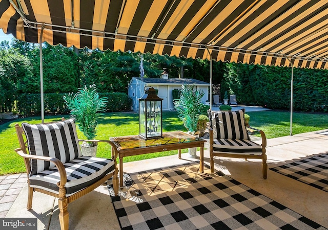 view of patio / terrace with a storage unit and an outdoor living space