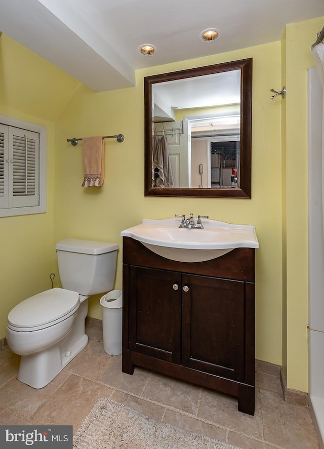 bathroom with vanity and toilet