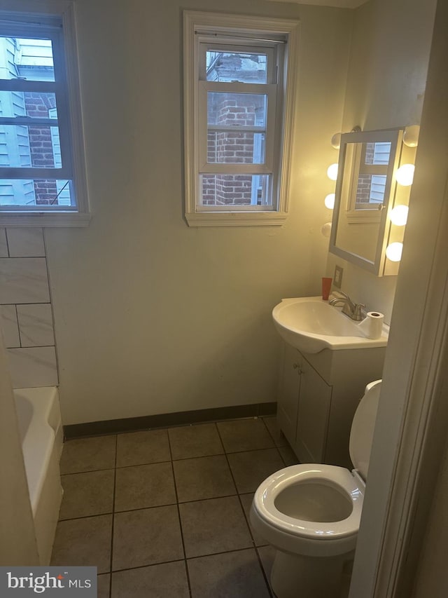 full bathroom with vanity, toilet, tile patterned floors, and shower with separate bathtub