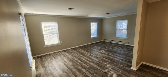 unfurnished room featuring dark wood-type flooring, ornamental molding, and baseboard heating