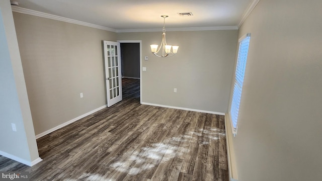 unfurnished room featuring a notable chandelier, ornamental molding, and dark hardwood / wood-style flooring