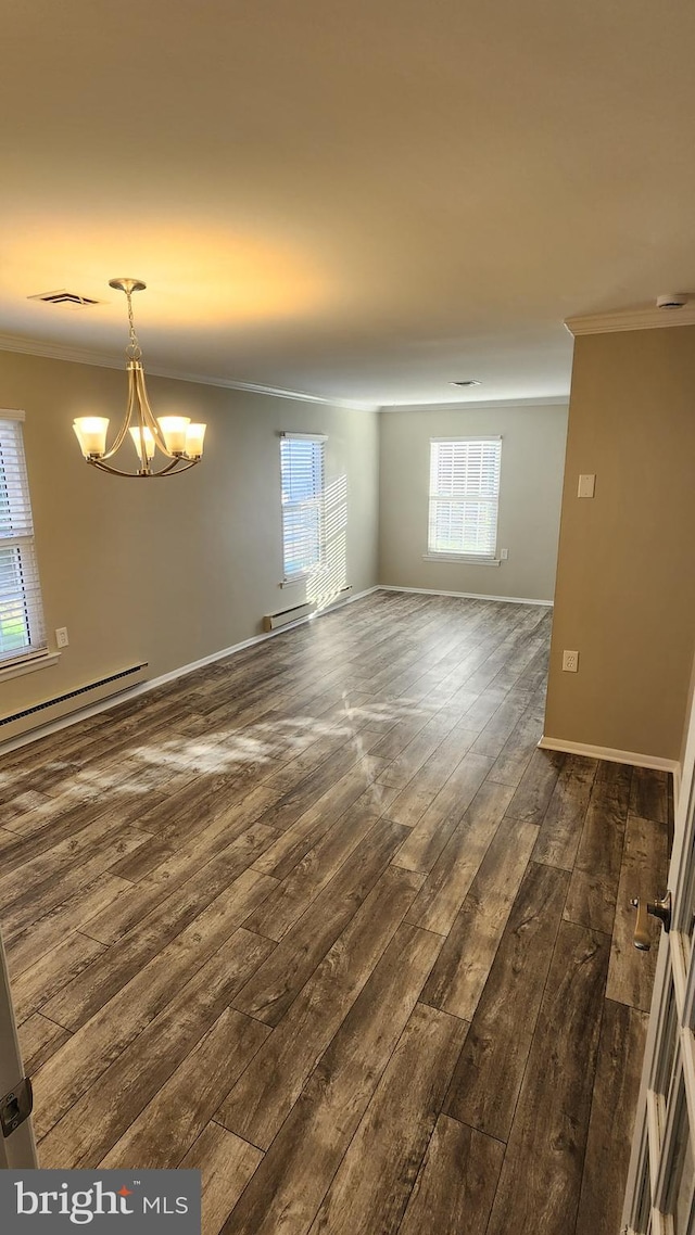 unfurnished room featuring a baseboard radiator, crown molding, dark hardwood / wood-style flooring, and a chandelier