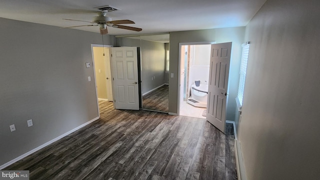 interior space featuring ceiling fan and dark hardwood / wood-style flooring