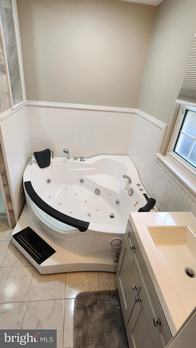 bathroom with a bathtub and vanity