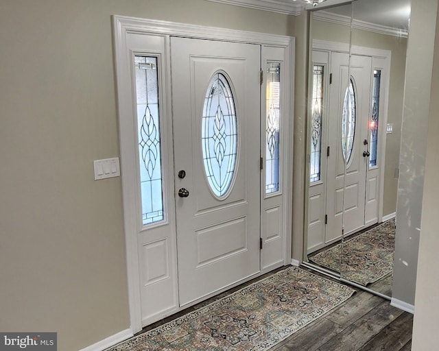 foyer featuring crown molding and hardwood / wood-style floors