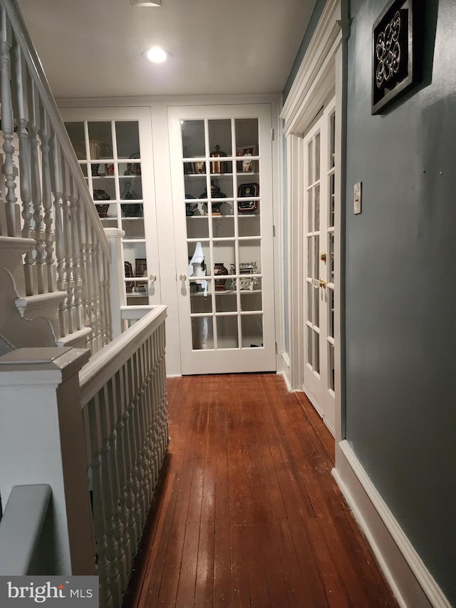 corridor featuring dark wood-type flooring