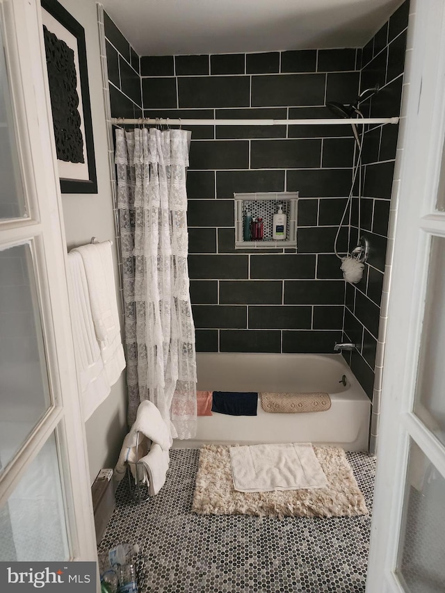 bathroom featuring shower / bath combo and tile patterned flooring