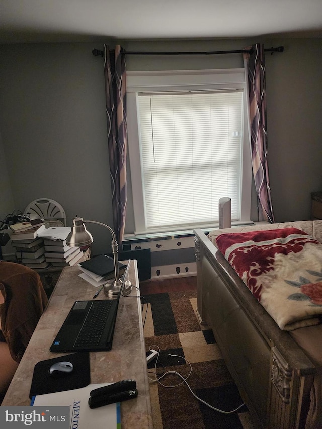 bedroom featuring dark colored carpet