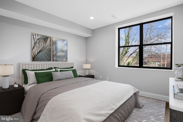 bedroom with hardwood / wood-style floors