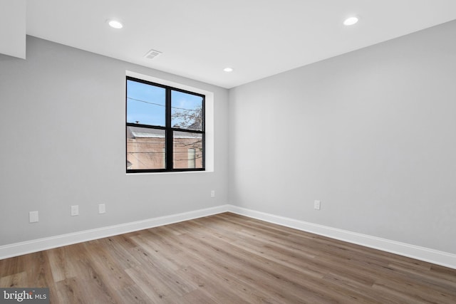 empty room with light hardwood / wood-style floors