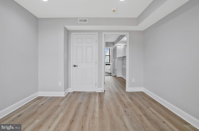 spare room with light wood-type flooring