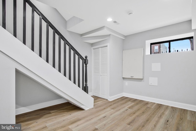 staircase featuring wood-type flooring