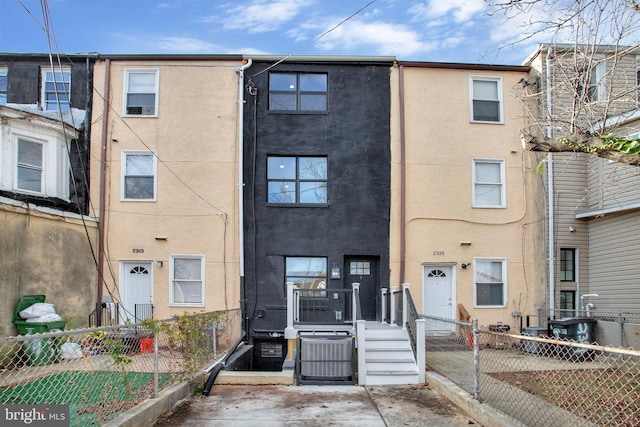 view of property featuring central AC unit