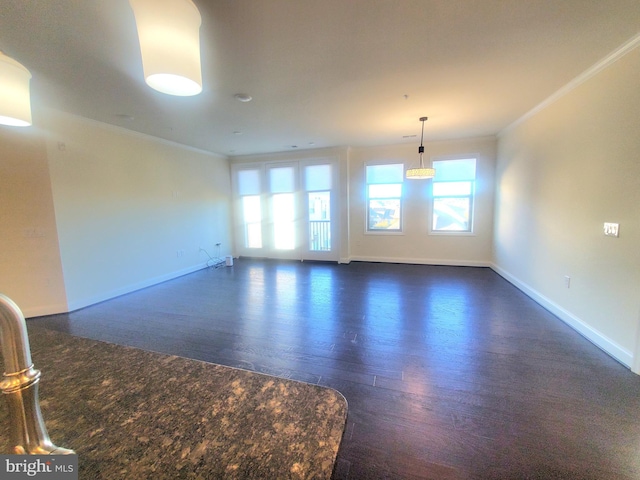 unfurnished room featuring crown molding and dark hardwood / wood-style floors