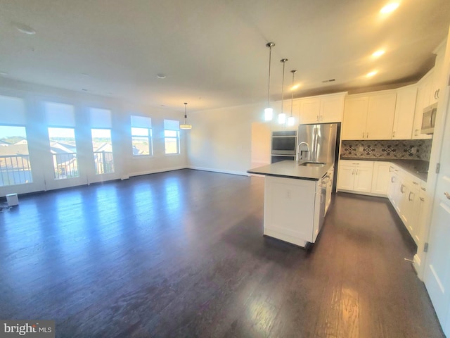 kitchen featuring backsplash, white cabinets, stainless steel fridge with ice dispenser, dark hardwood / wood-style floors, and hanging light fixtures