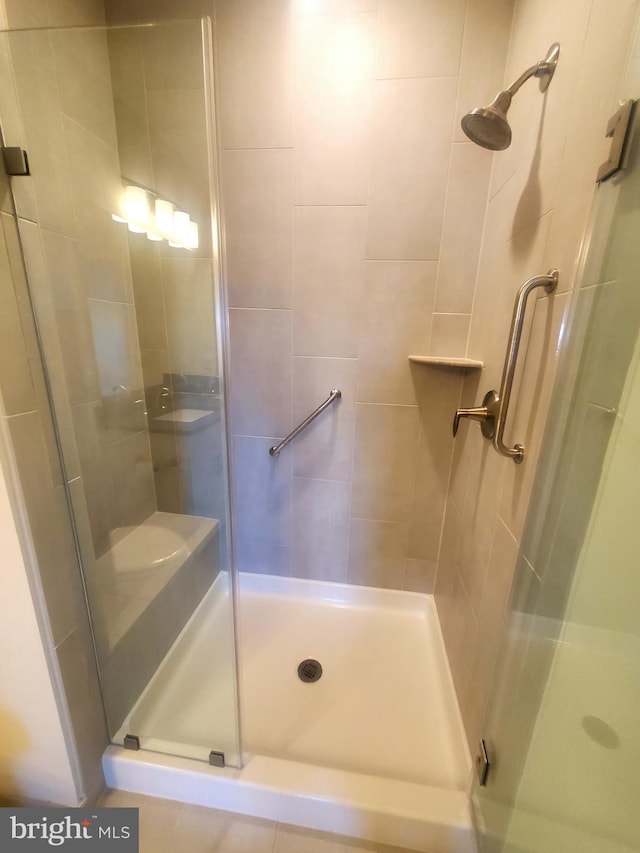 bathroom featuring an enclosed shower