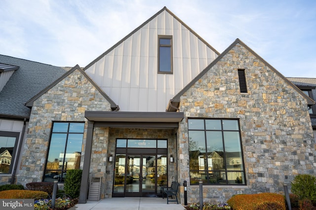 view of exterior entry featuring french doors