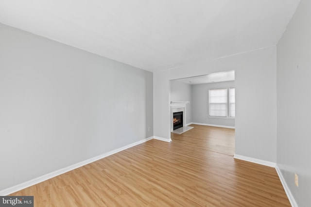 unfurnished living room with light hardwood / wood-style flooring