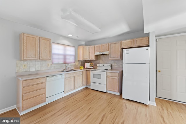 kitchen featuring light hardwood / wood-style floors, light brown cabinets, and white appliances