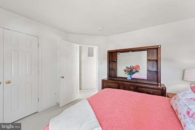 bedroom with light colored carpet