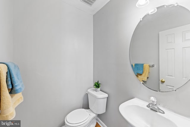 bathroom with sink and toilet