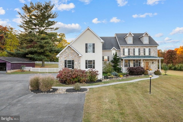 view of front of home with a front lawn