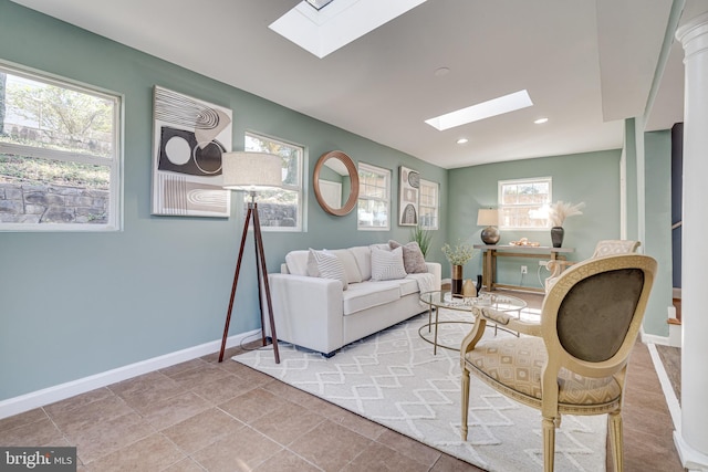 sitting room featuring light tile patterned floors and plenty of natural light