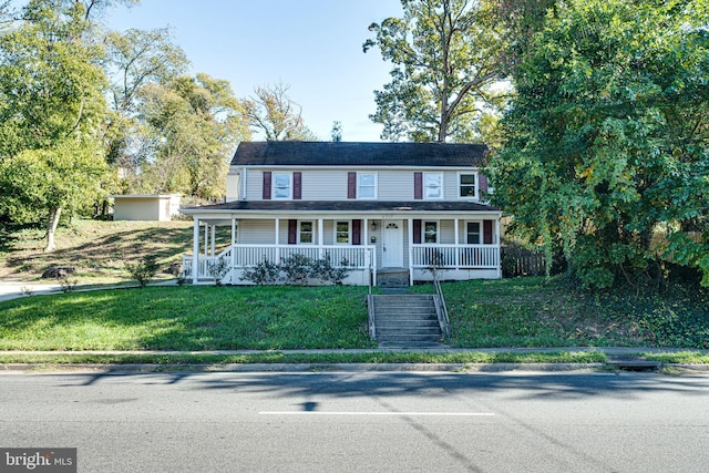 view of front of property featuring a porch and a front lawn