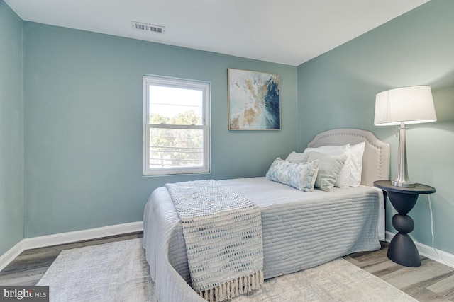 bedroom featuring hardwood / wood-style flooring