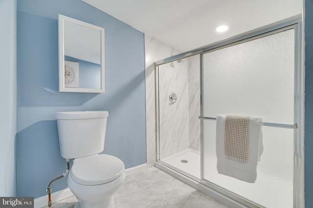 bathroom with toilet and walk in shower