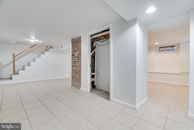 basement with light tile patterned flooring