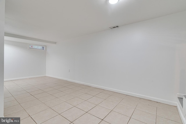 spare room featuring light tile patterned floors