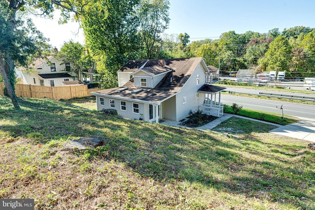 view of home's exterior with a yard