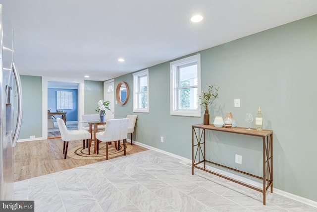 dining space with light wood-type flooring