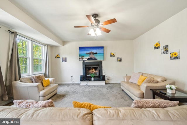 carpeted living room with ceiling fan