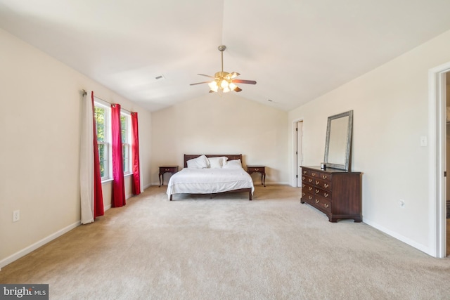 carpeted bedroom featuring ceiling fan and vaulted ceiling