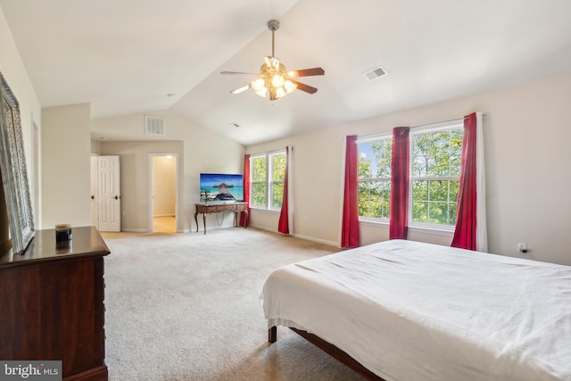 bedroom with lofted ceiling, light colored carpet, and ceiling fan