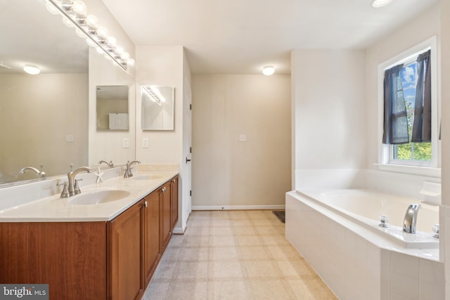 bathroom featuring vanity and tiled bath