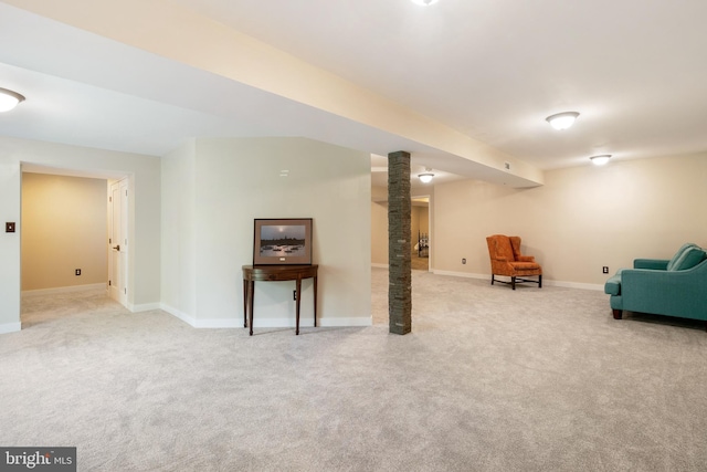 basement featuring light carpet