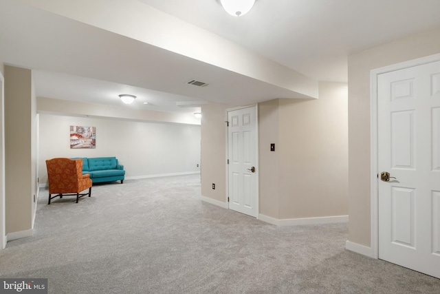 living area featuring light colored carpet