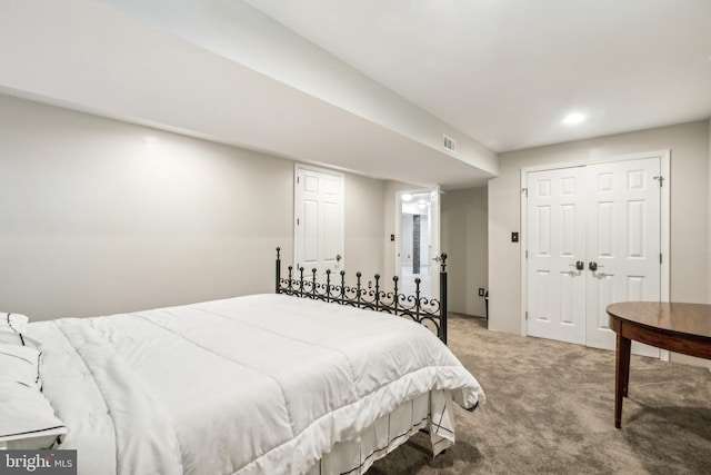 bedroom with carpet and a closet