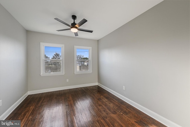 unfurnished room featuring dark wood-type flooring and ceiling fan