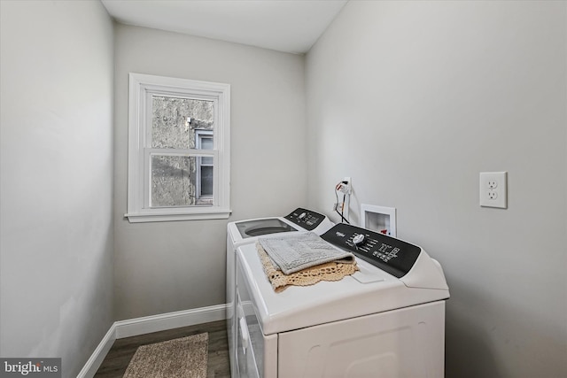 washroom featuring washer and dryer and dark hardwood / wood-style floors