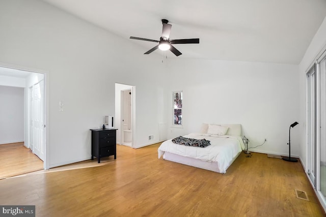 unfurnished bedroom with hardwood / wood-style flooring, high vaulted ceiling, and ceiling fan